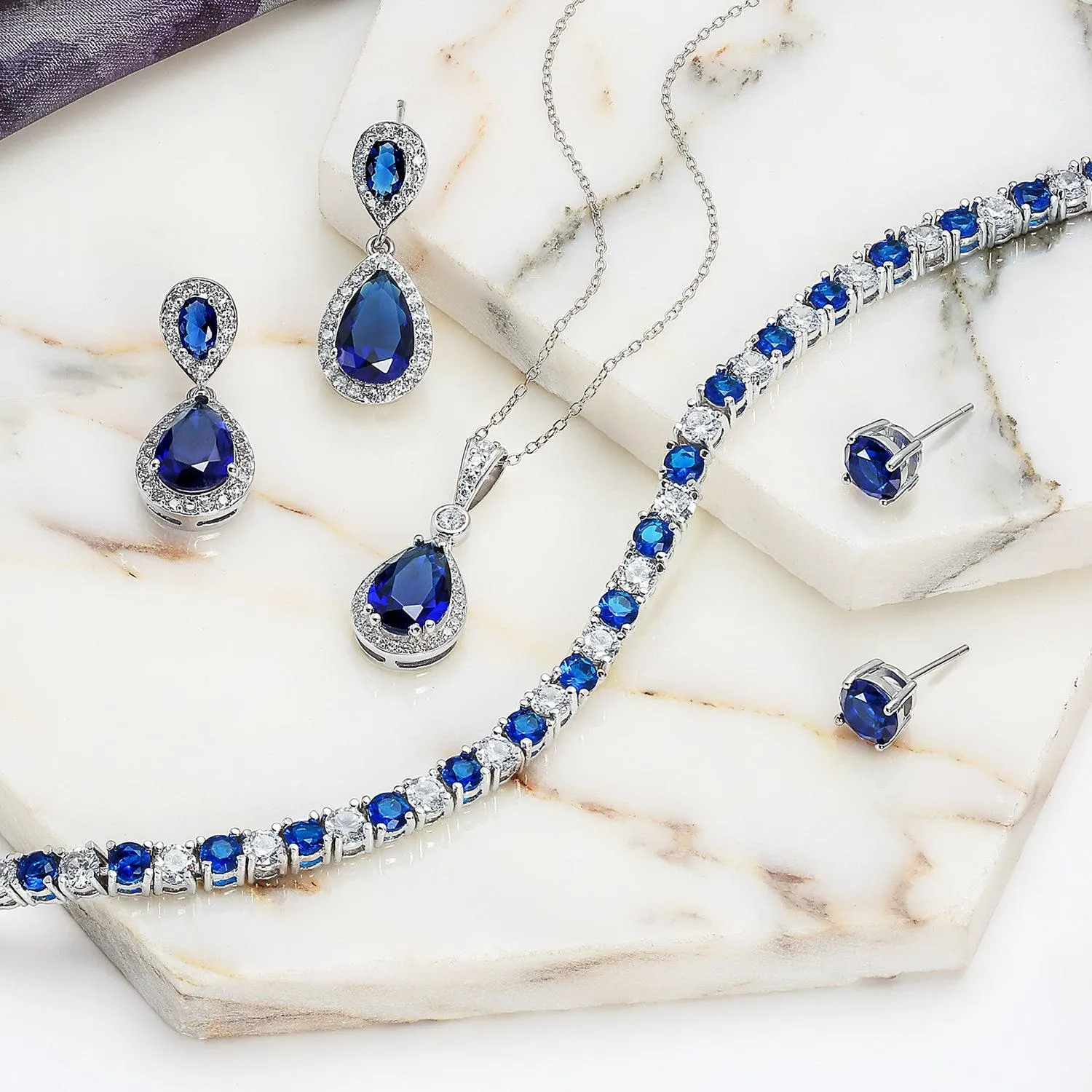 Blue Simulated Sapphire Teardrop Pendant Necklace in Sterling Silver CZ Halo Design